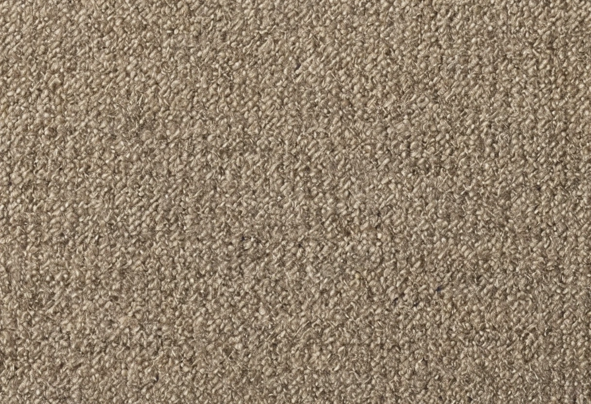 Stack of tonal boucl&eacute; fabric swatches in cream and oatmeal shades showing looped surfaces